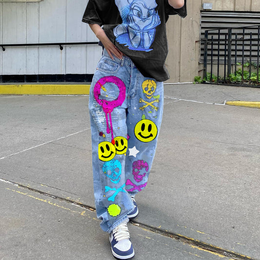 High-waisted printed denim pants with smiling faces